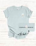 Champagne Problems tee | Champagne glass chest logo, text back